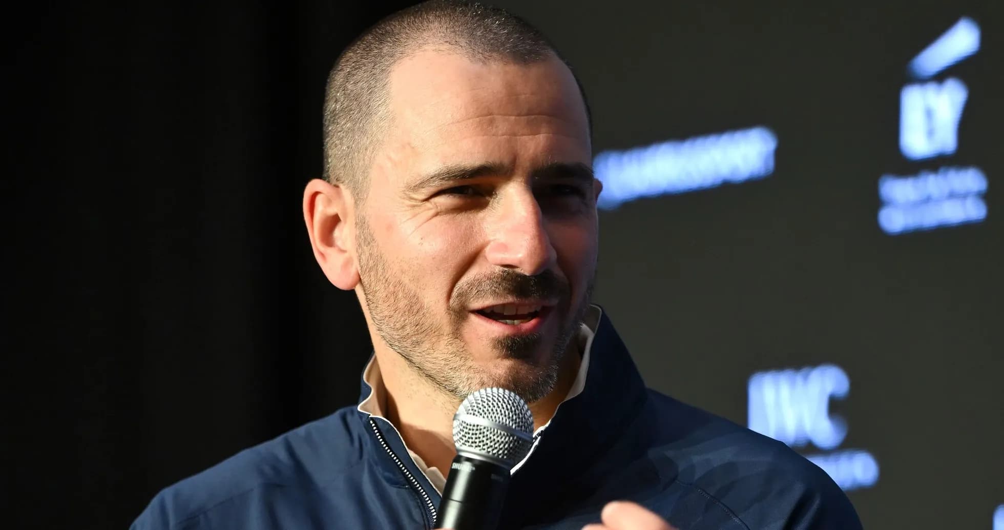 Speaker at event holding microphone and talking