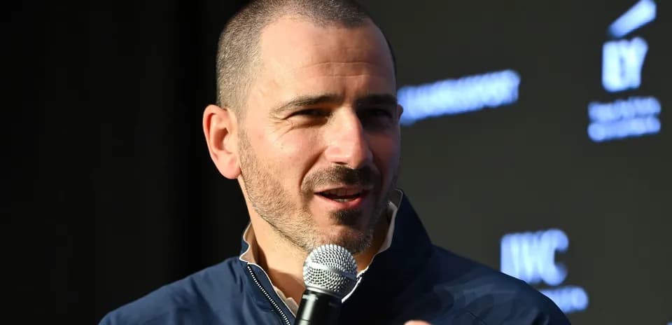 Speaker at event holding microphone and talking