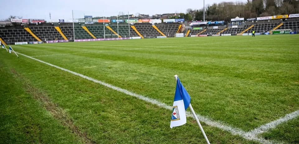 Corner flag at empty football stadium pitch