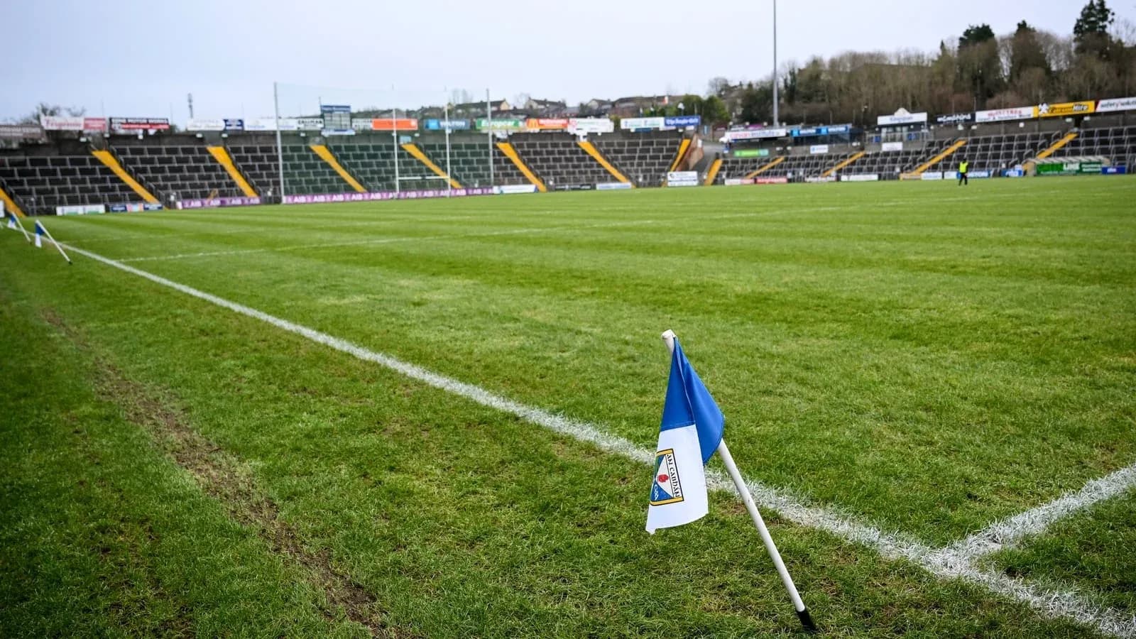 Corner flag at empty football stadium pitch