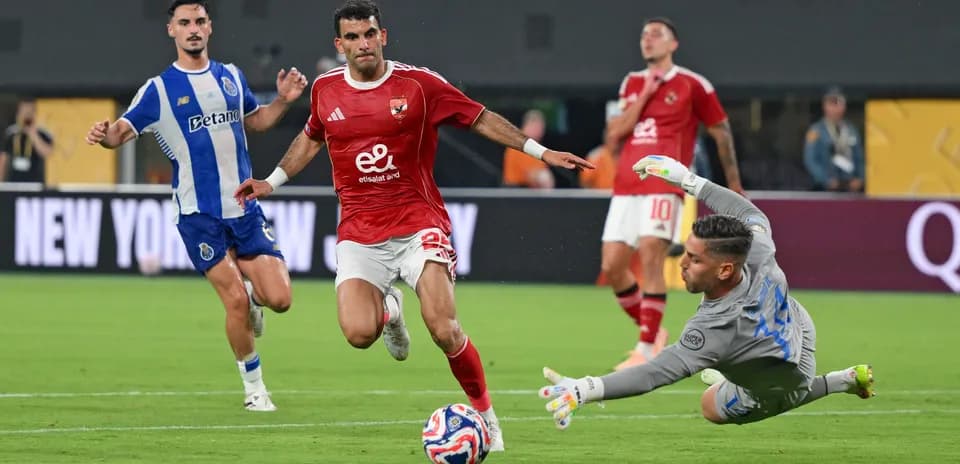 Player attempting to score while goalkeeper dives