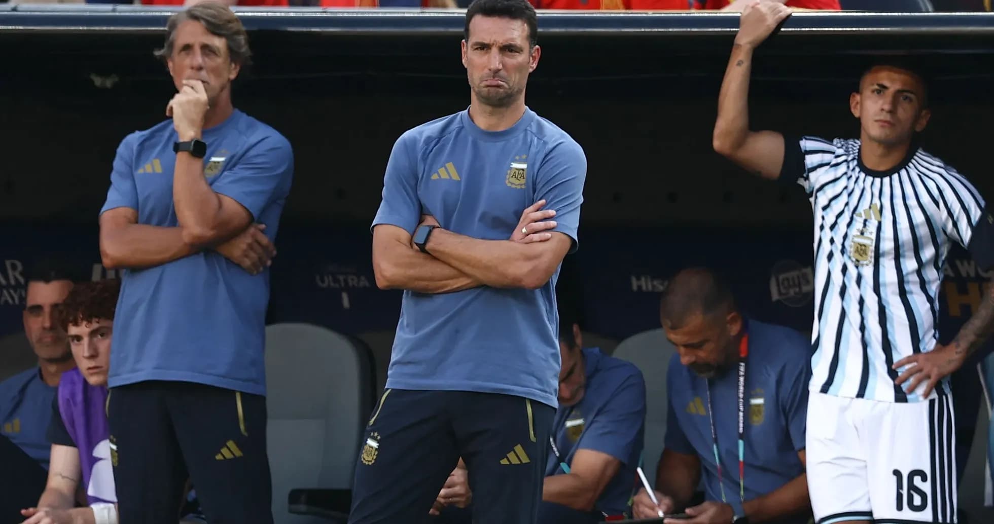 Coaches and staff observing from the bench