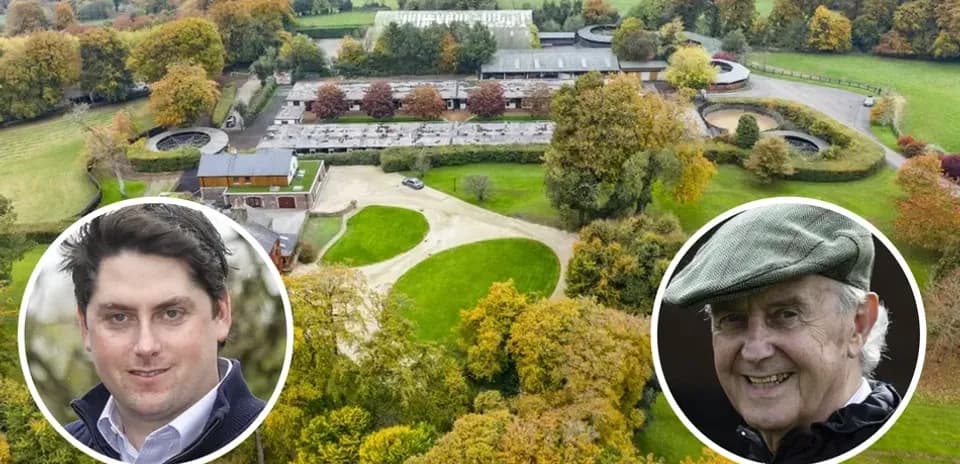 Aerial view of horse training facility with two men