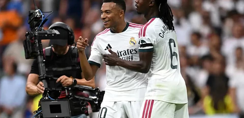 Mbappé and Camavinga celebrating on the pitch