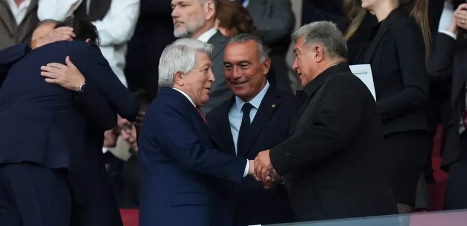 Officials shaking hands in the stadium stands