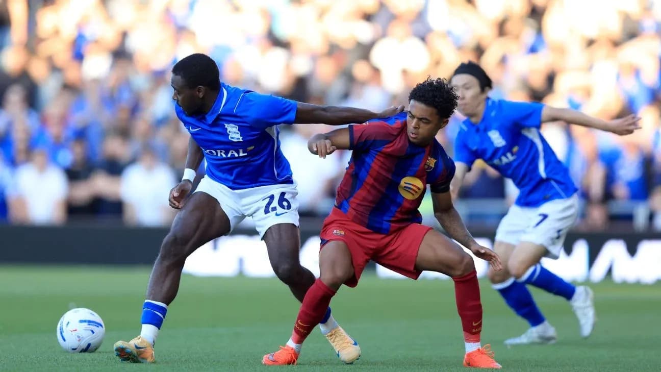 Birmingham City and Barcelona players competing for the ball