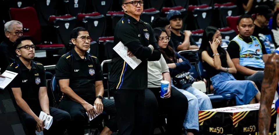 Coaching staff observing game from sidelines