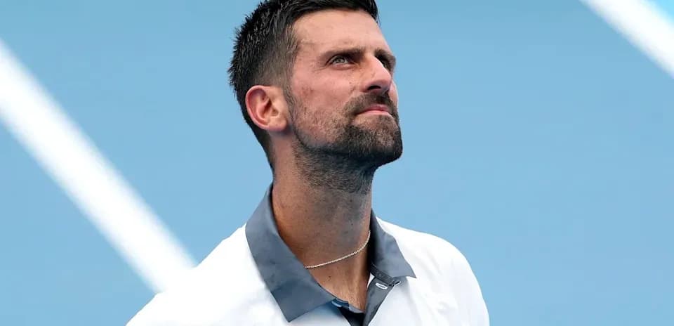 Tennis player looking up during match