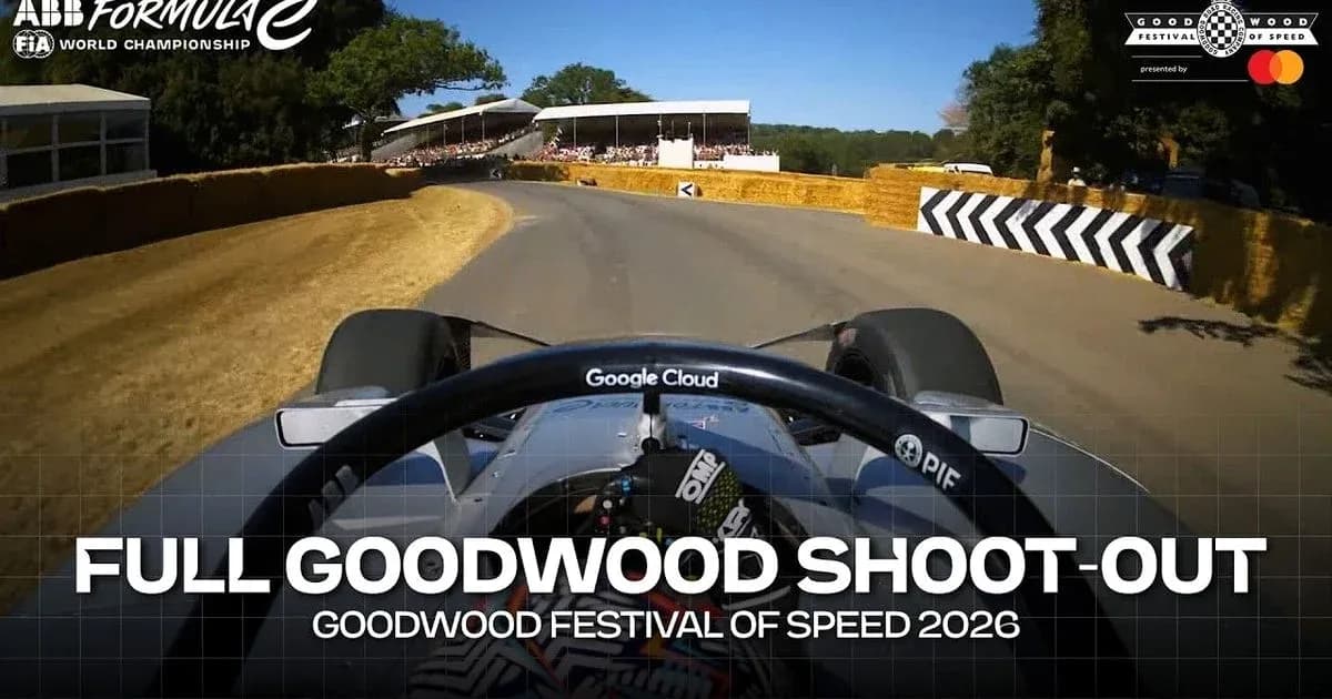 Formula E car navigating turn at Goodwood Festival
