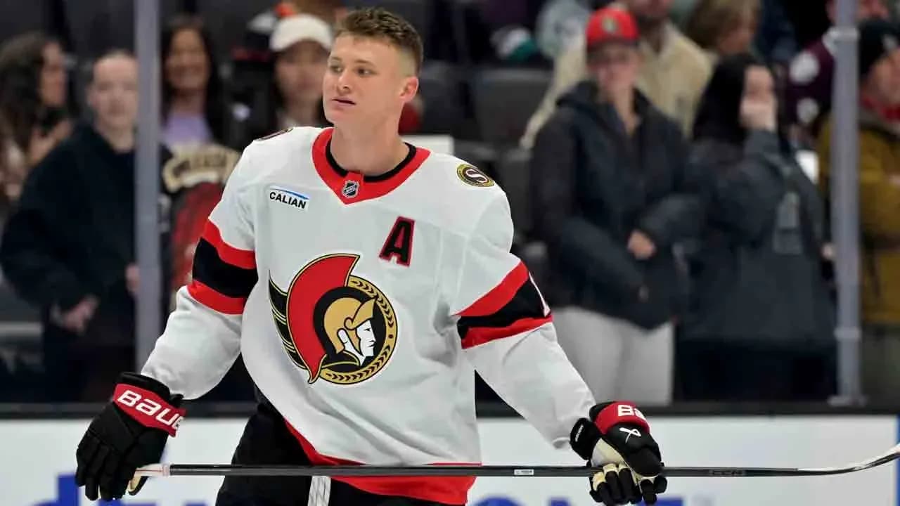 Hockey player in Ottawa Senators jersey on ice