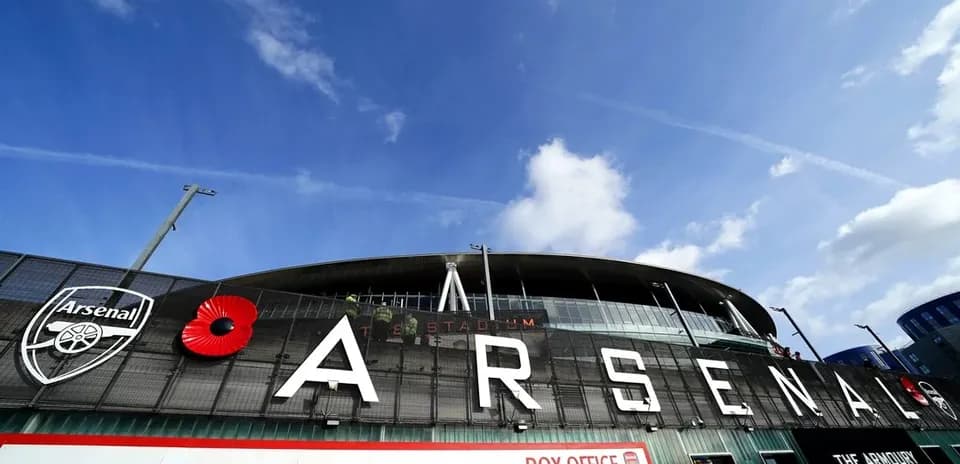 Arsenal stadium entrance with logo and poppy