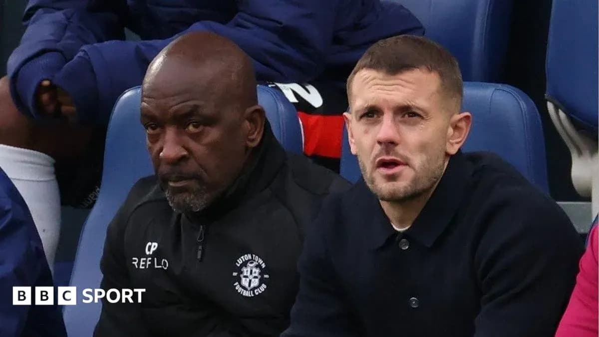 Two men sitting on the bench during a match