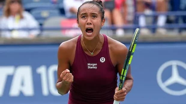 Tennis player celebrating after winning a point