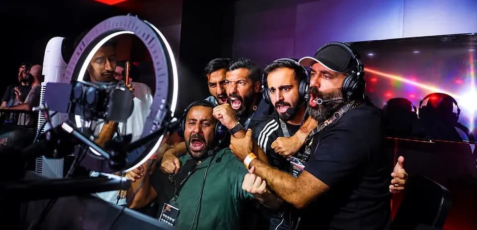 Group of commentators celebrating during esports event