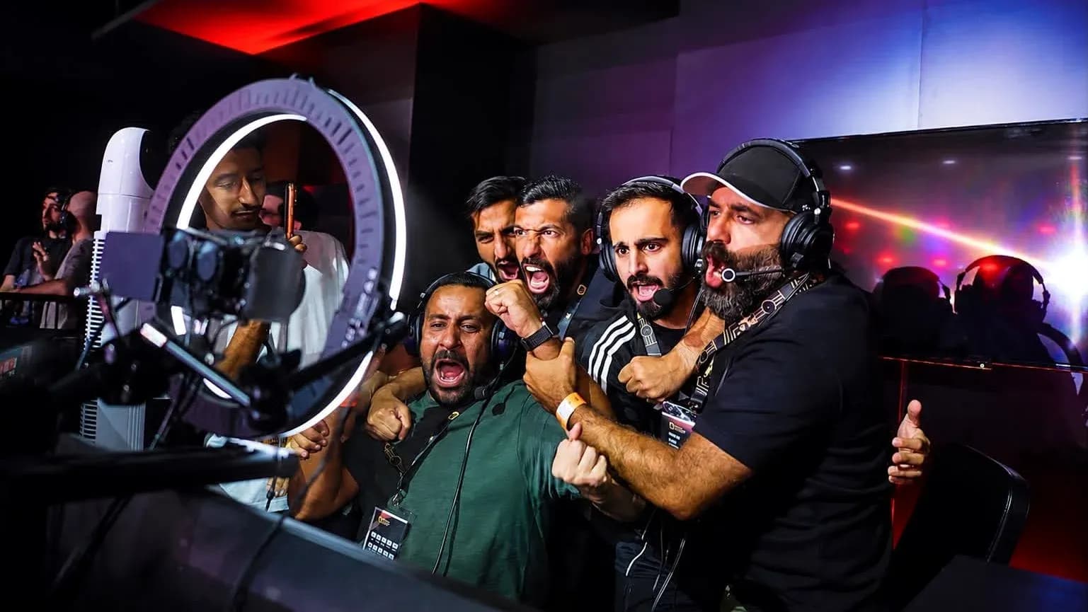Group of commentators celebrating during esports event Group of commentators celebrating during esports event