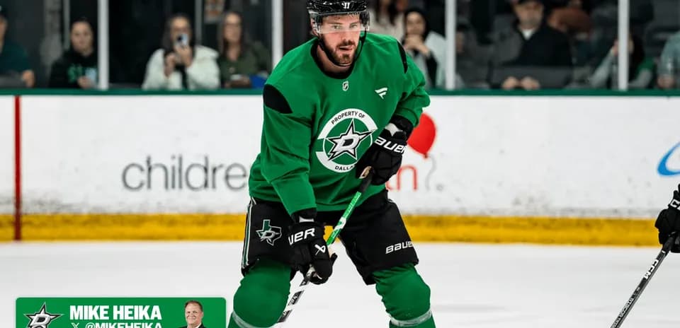 Hockey player practicing on ice in green jersey