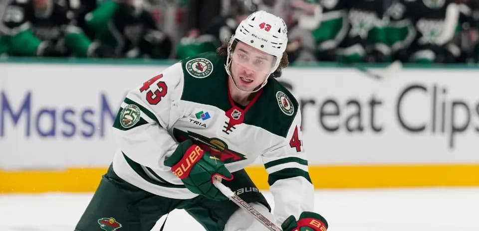 Hockey player skating on the ice during match