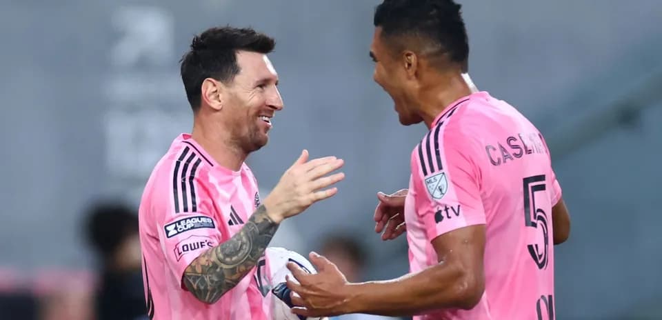 Messi and teammate celebrating a goal together