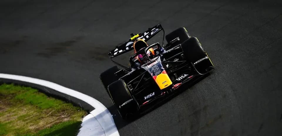 Formula 1 car navigating a curve on track
