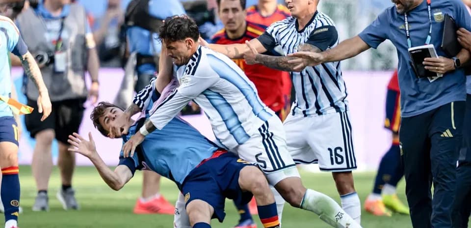 Players clashing during intense football match confrontation