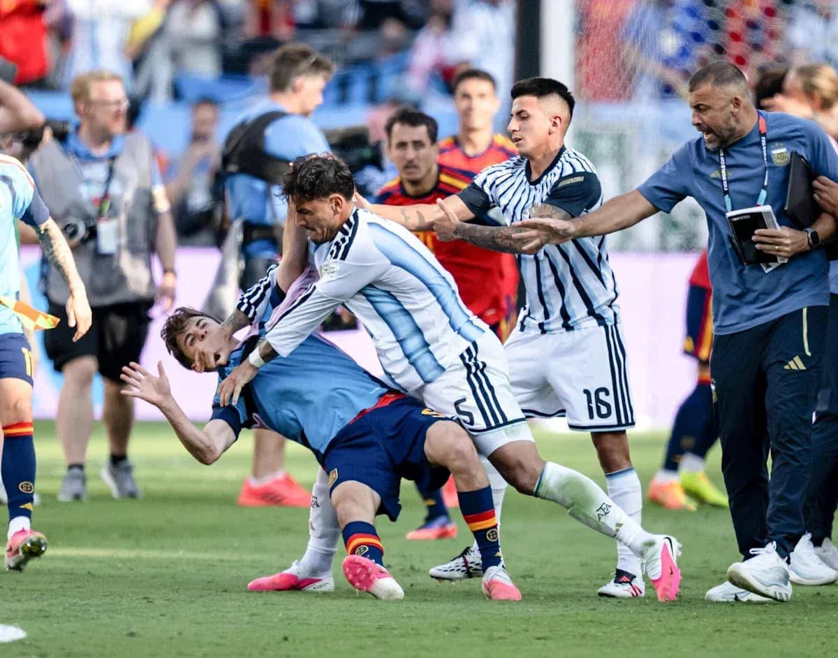 Players clashing during intense football match confrontation