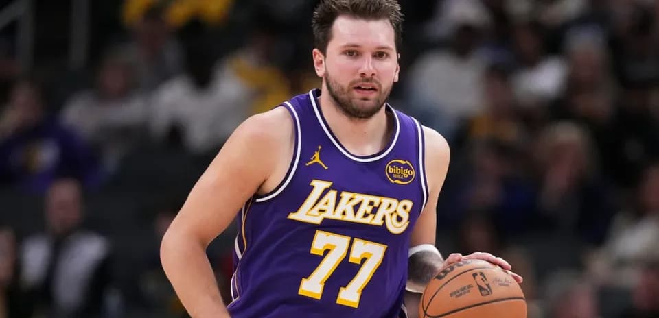 Basketball player dribbling during game for Lakers