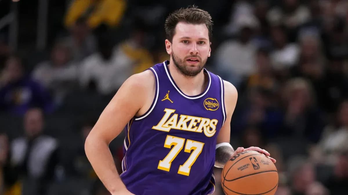 Basketball player dribbling during game for Lakers