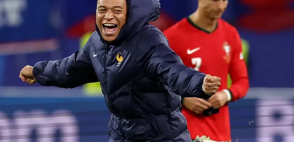 Mbappe celebrating in France jacket, Ronaldo in background