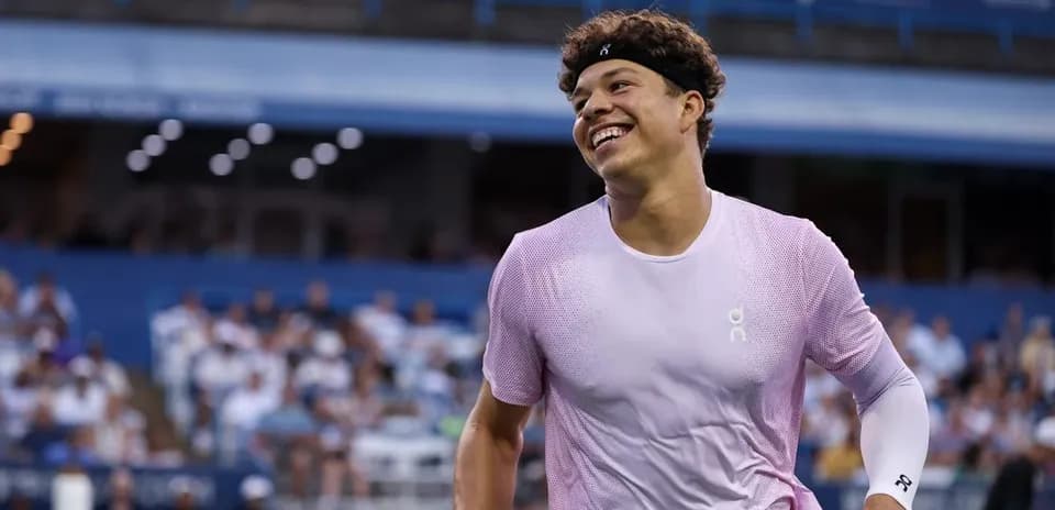 Tennis player smiling during a match