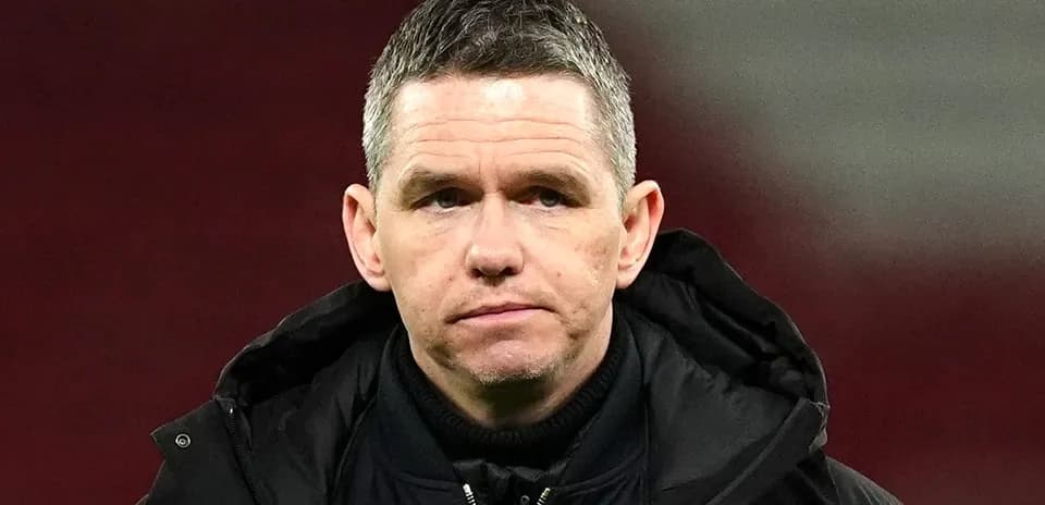 Men's football coach during post-match interview