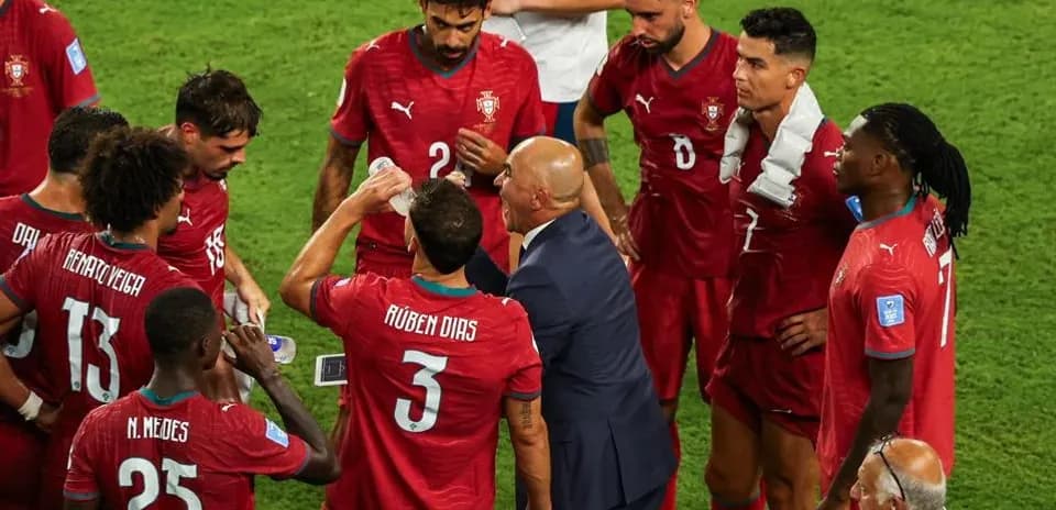 Portugal team receiving instructions from coach during match