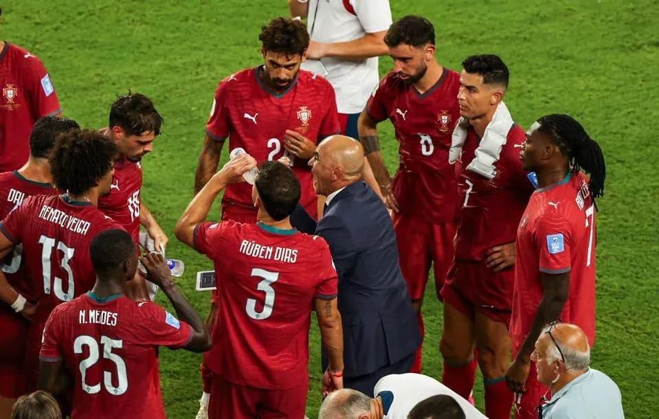 Portugal team receiving instructions from coach during match