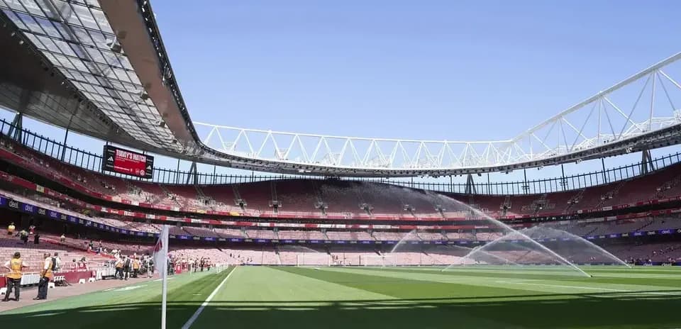 Emirates Stadium field with sprinklers on