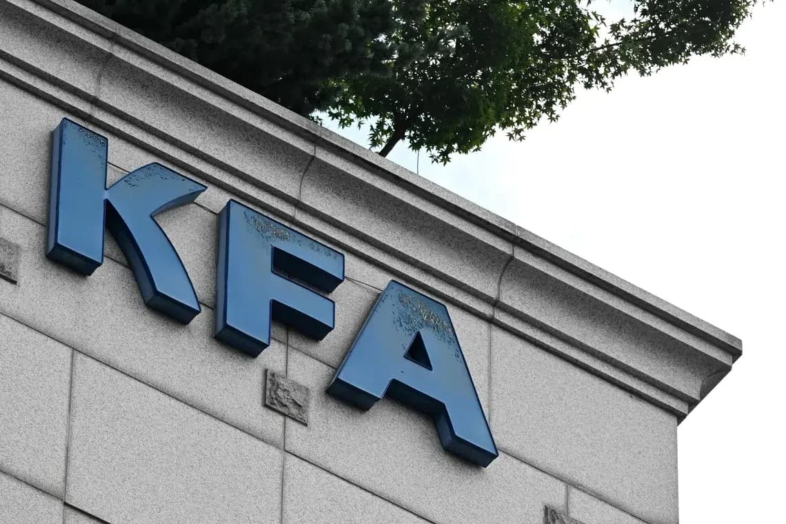KFA sign on building exterior with trees