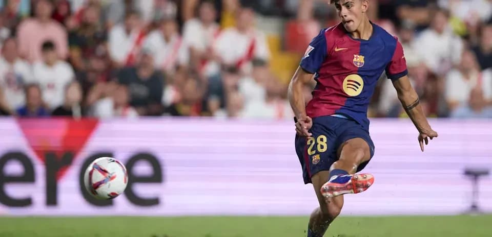 Barcelona player striking the ball during match