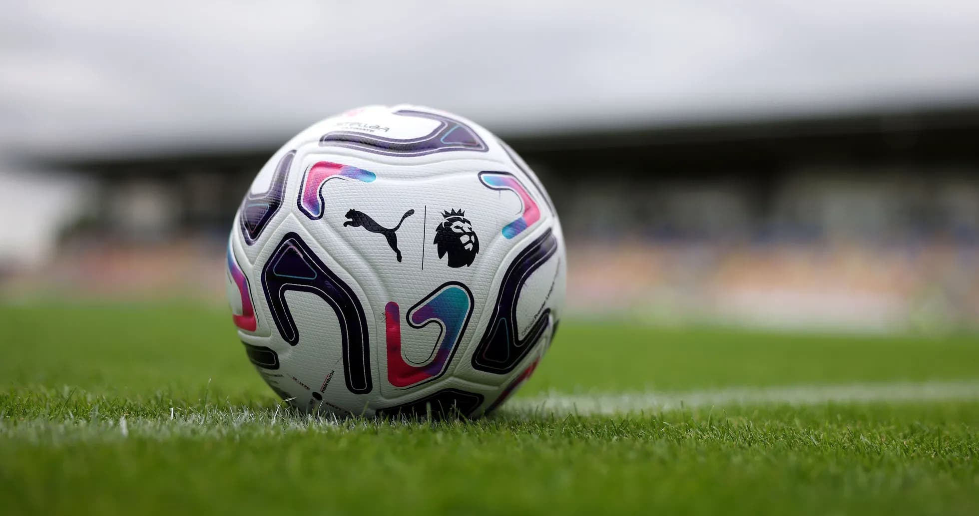 Puma Premier League football on grass pitch