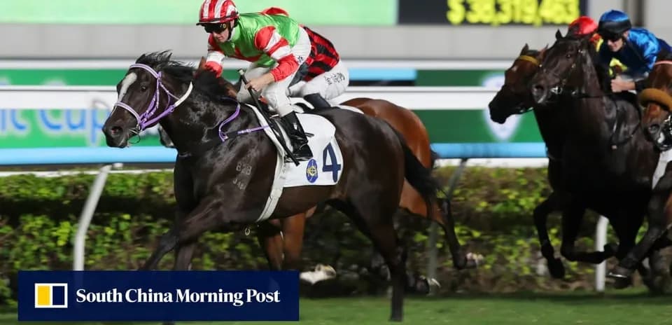Jockey racing on a horse during night event