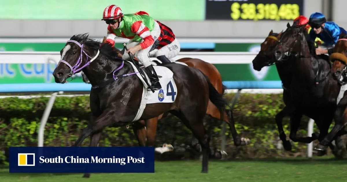 Jockey racing on a horse during night event