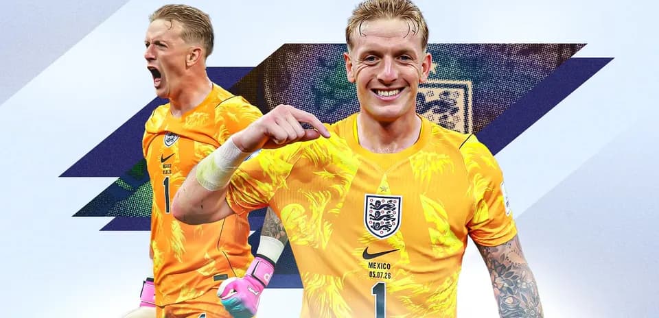 Goalkeeper celebrating in vibrant orange jersey