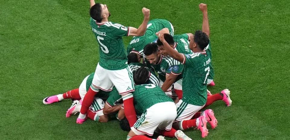 Mexican players celebrating after scoring a goal