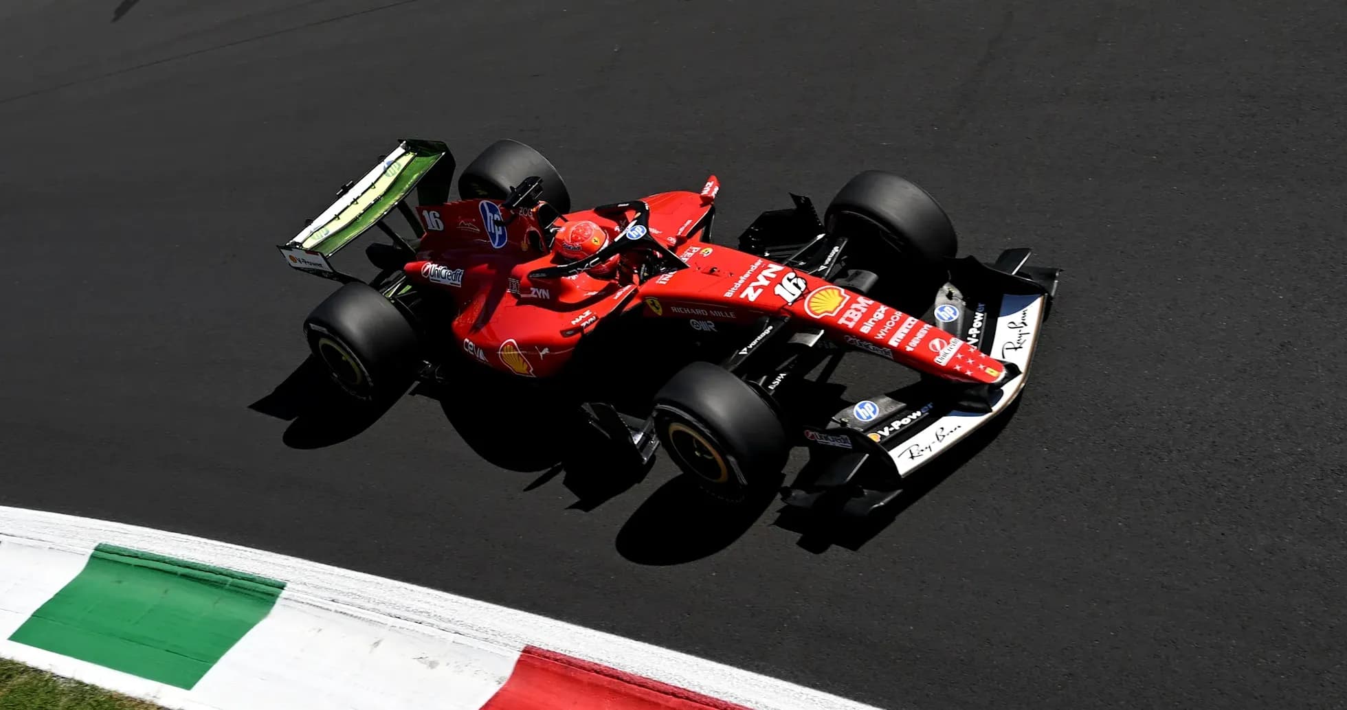 Ferrari car racing on track with Italian flag colors
