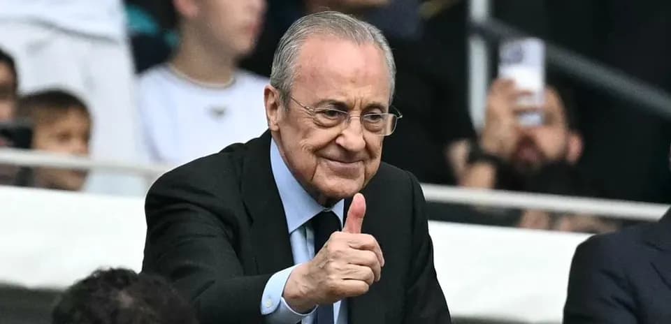 Person giving a thumbs up in stadium