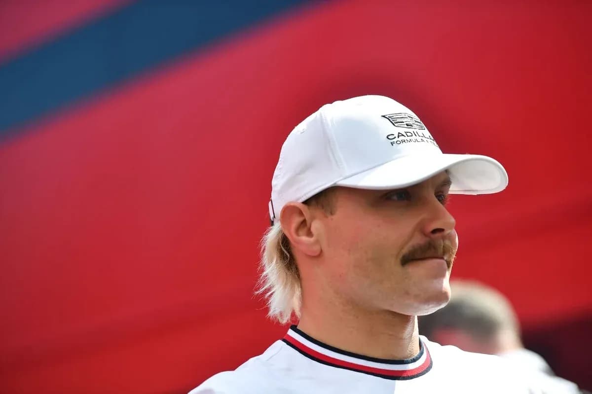 Driver wearing white cap at motorsport event