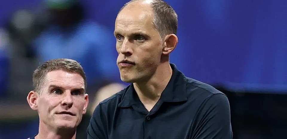 Coaches discussing strategy during a match