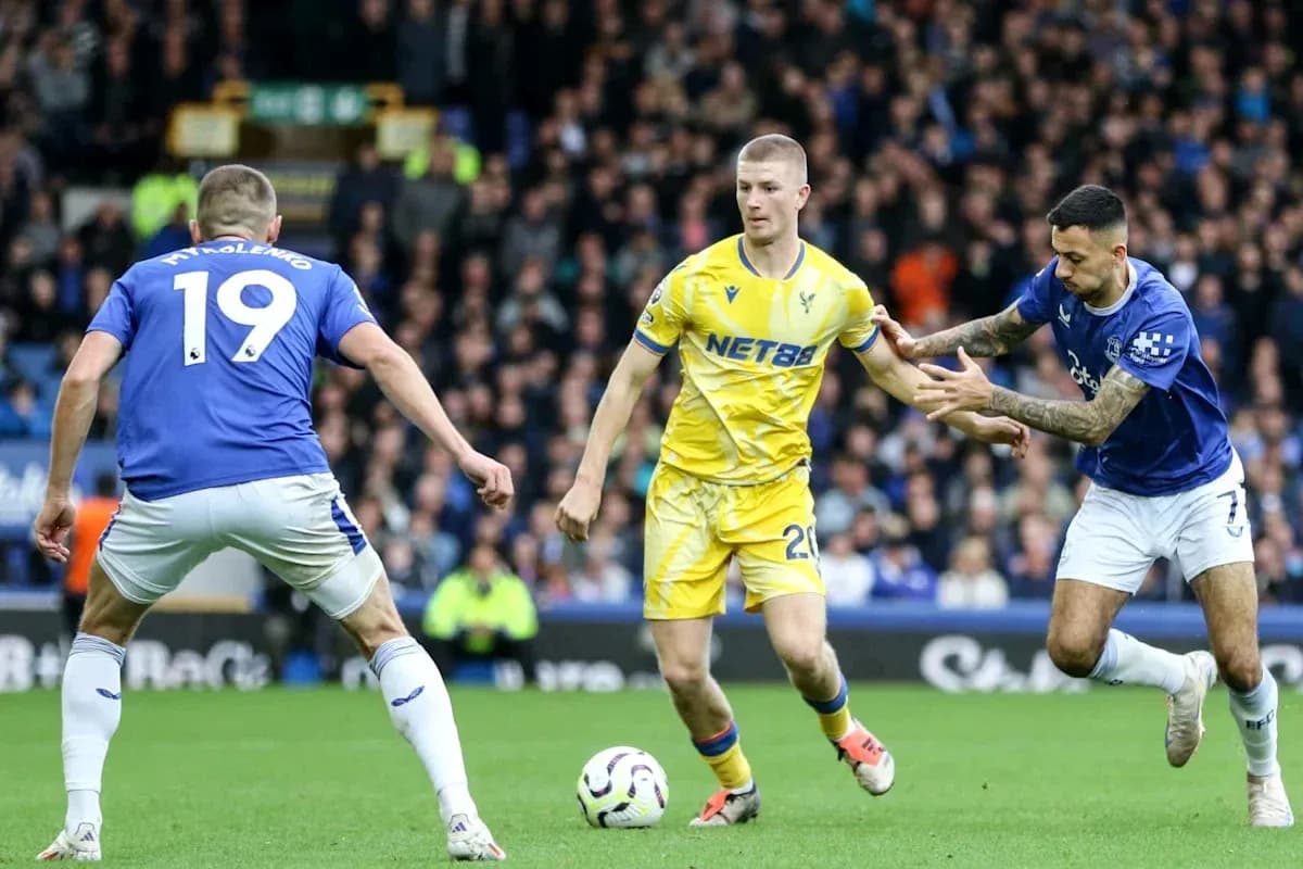 Two players contesting the ball during football match