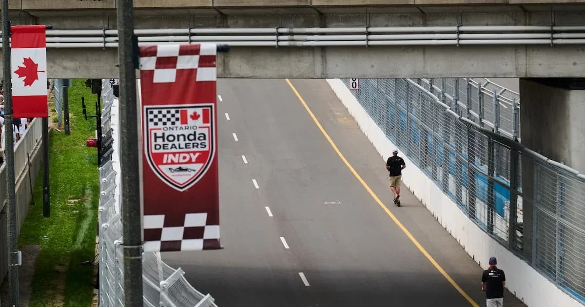 Person jogging on the track at Indy event Person jogging on the track at Indy event