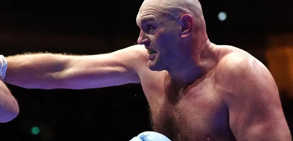 Boxer throwing a punch during a match