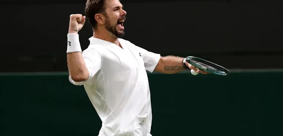 Tennis player celebrating a point on court