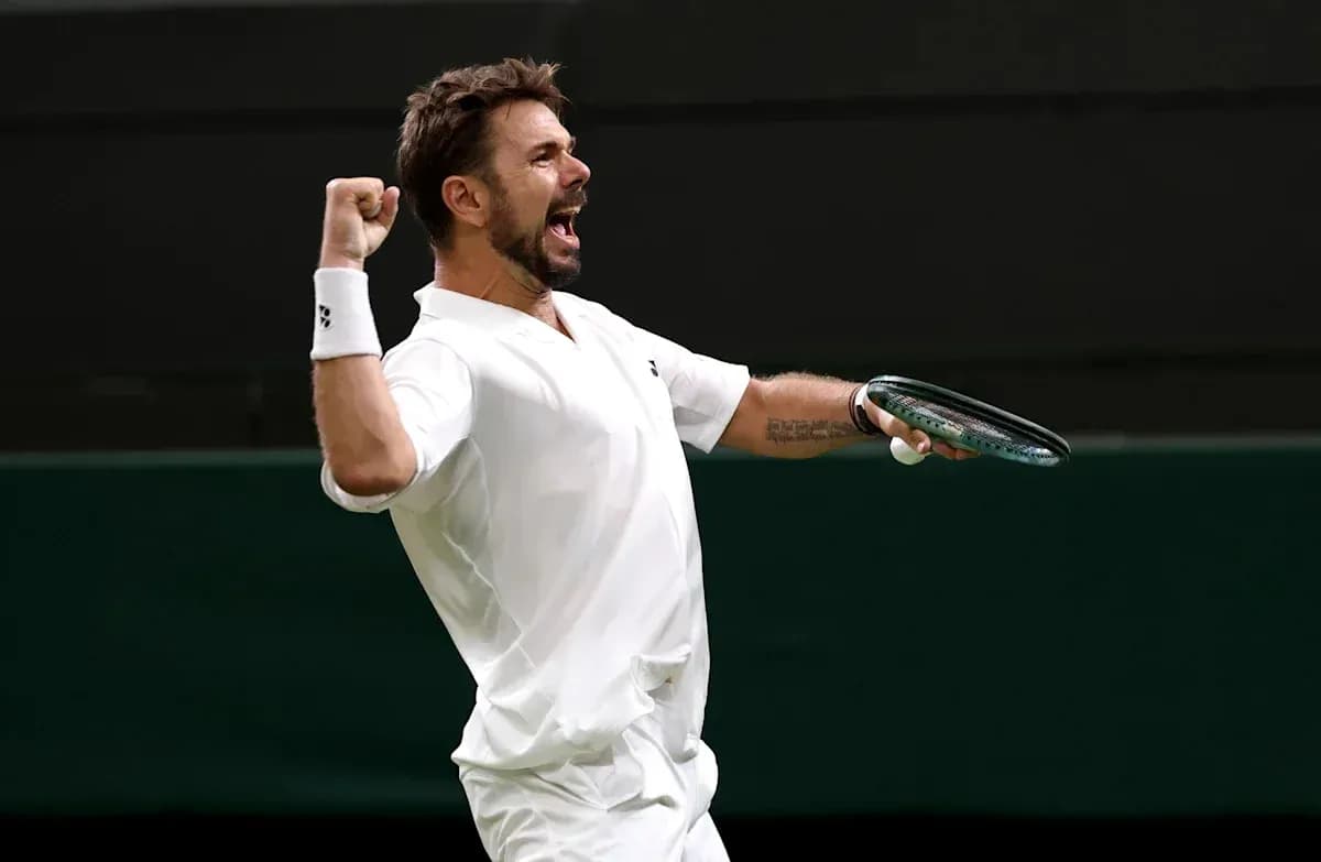 Tennis player celebrating a point on court