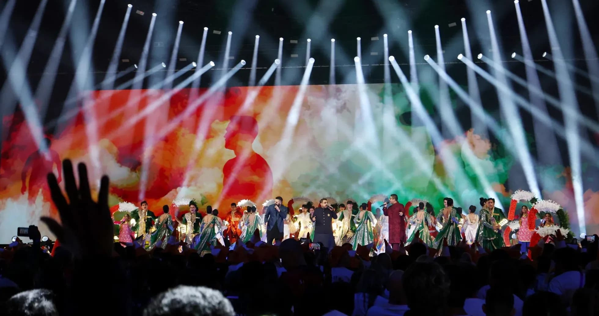 Performers on stage during a colorful event